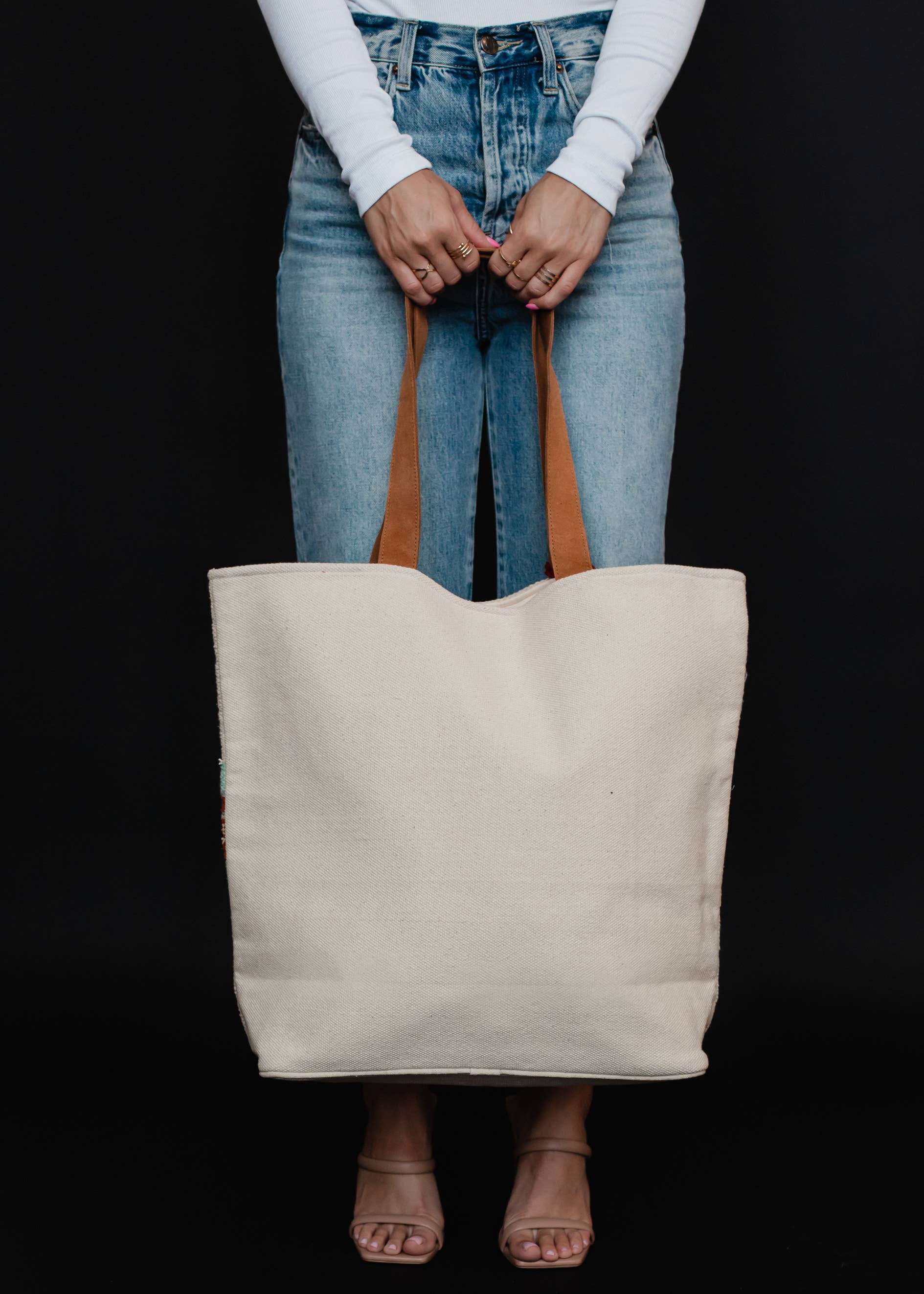 Aztec travel tote with leather handles and a red tassel accent. Plenty of Pattern